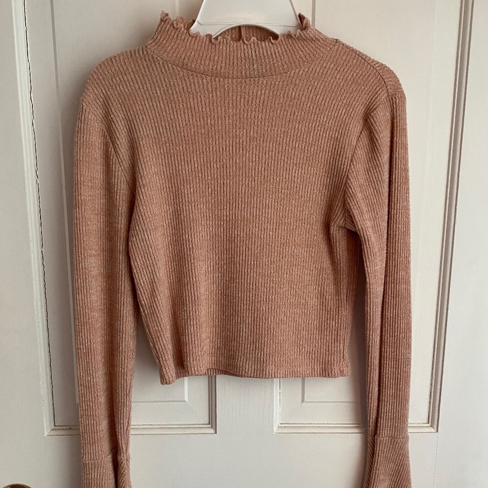 Light pink turtle neck with flare sleeves